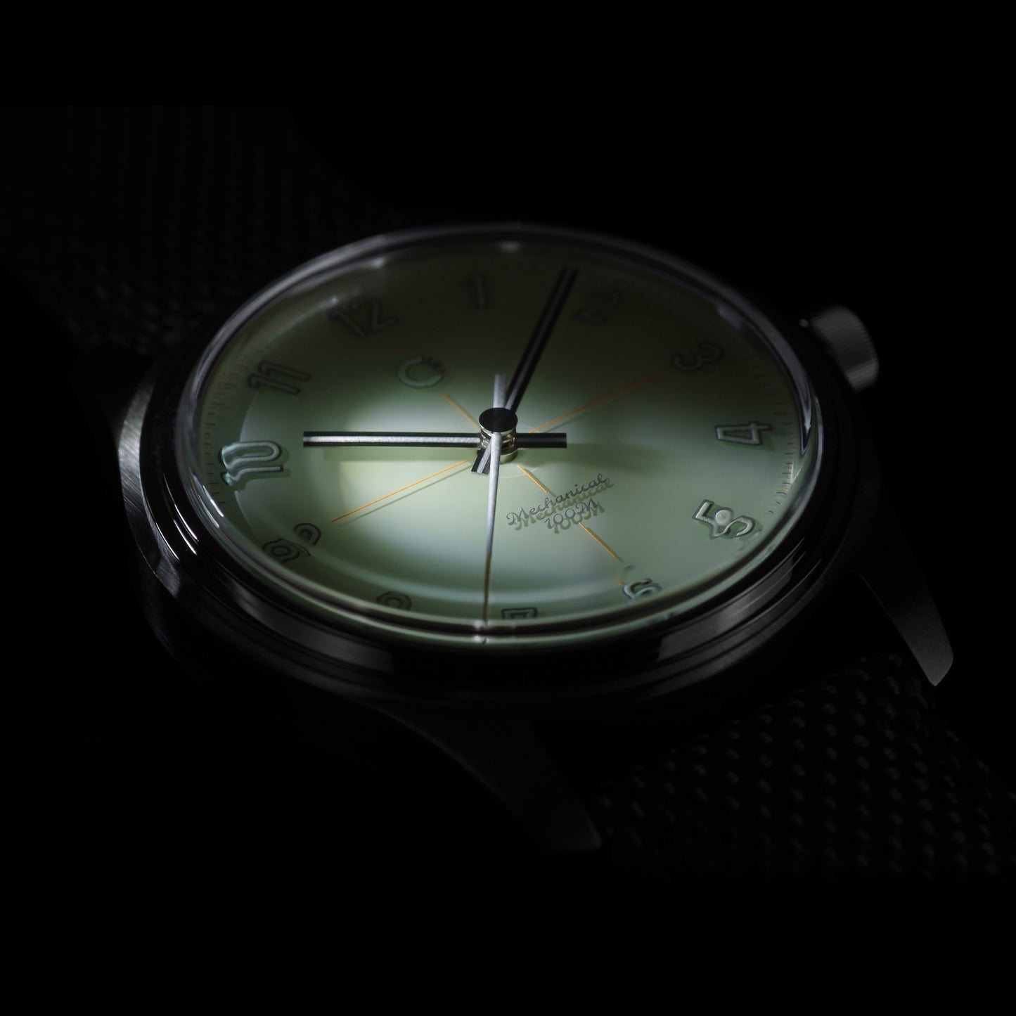 Dramatically lit photo of green Camp Fieldtimer mechanical luxury Swiss Made vintage inspired dress field watch for men and women with colorful lacquer enamel dial designed in Los Angeles, California